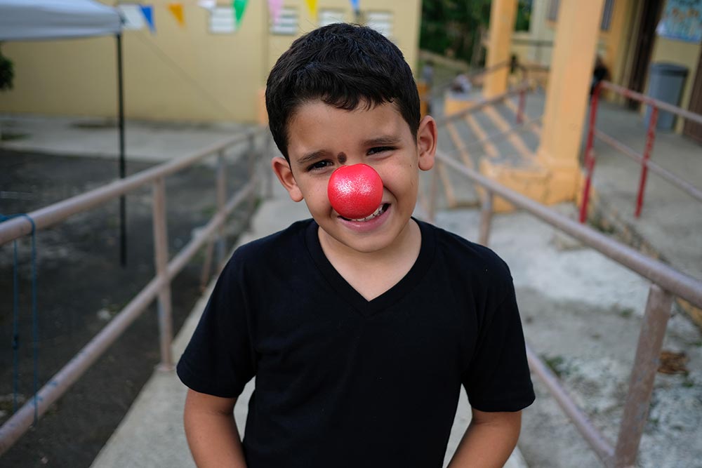 A young boy in Puerto Rico wearing a Red Nose.